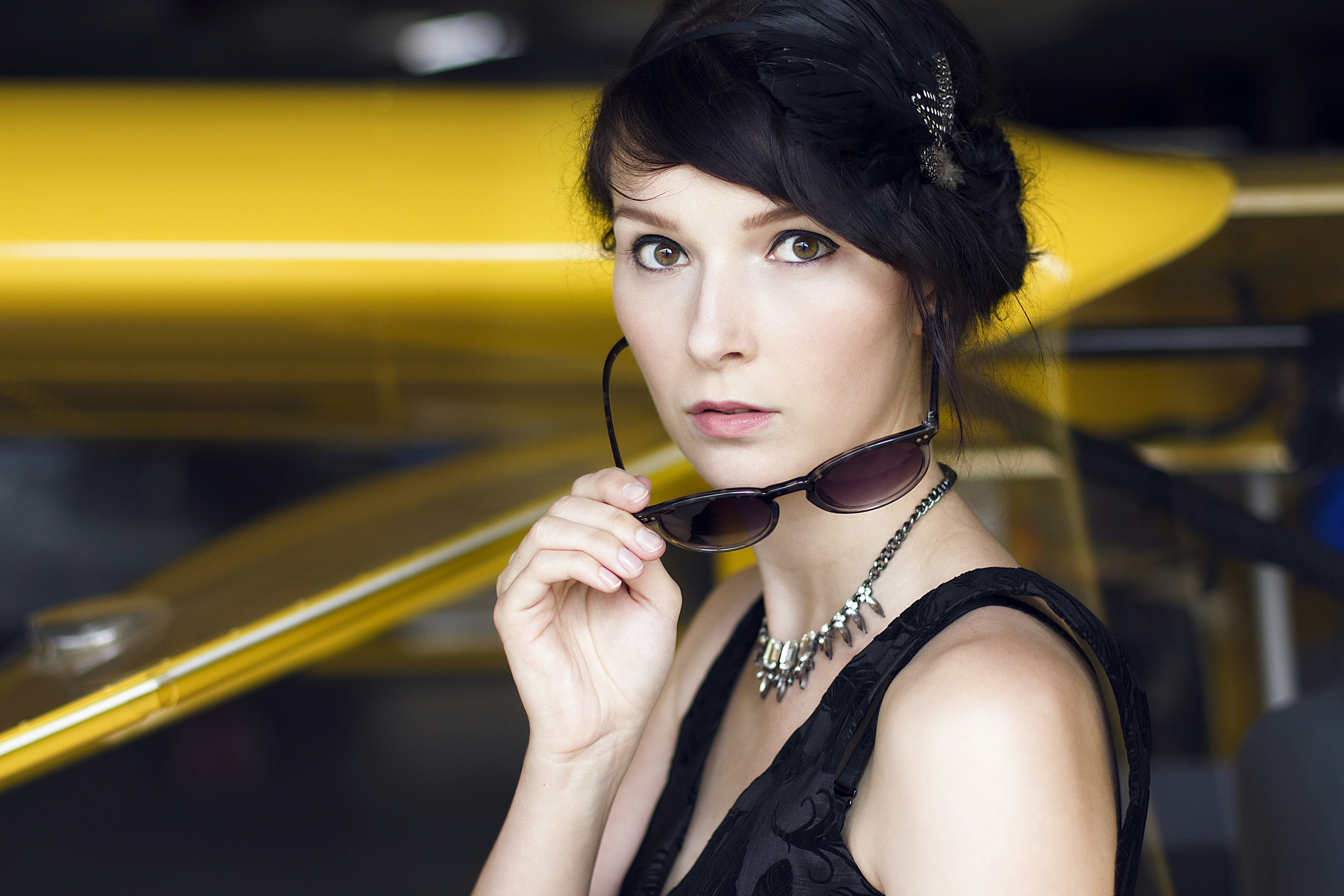 woman holding sunglasses