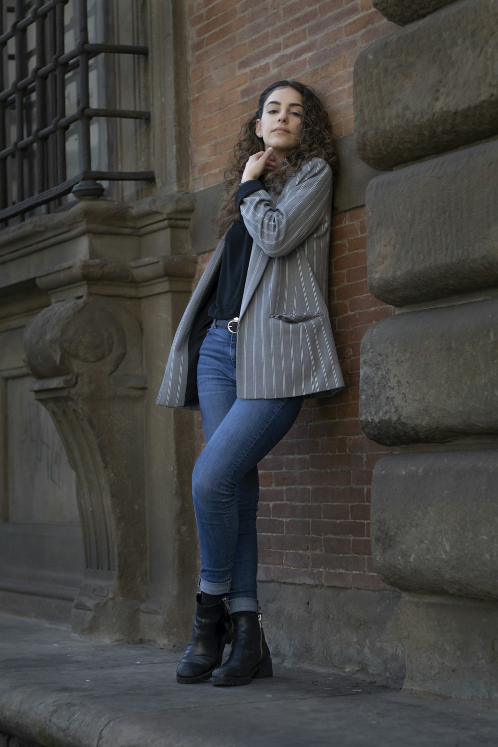 woman leaning against wall