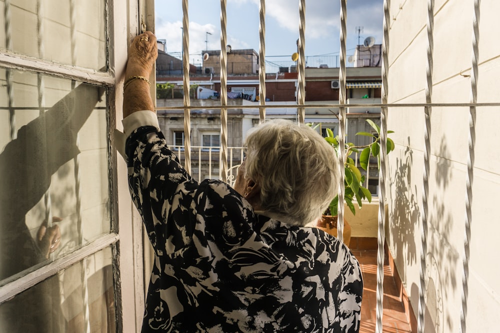 woman in front of metal gate