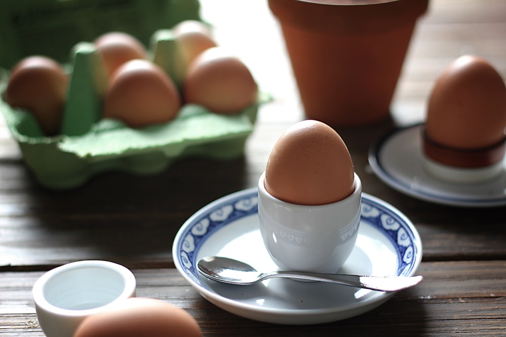 brown egg on white bowl