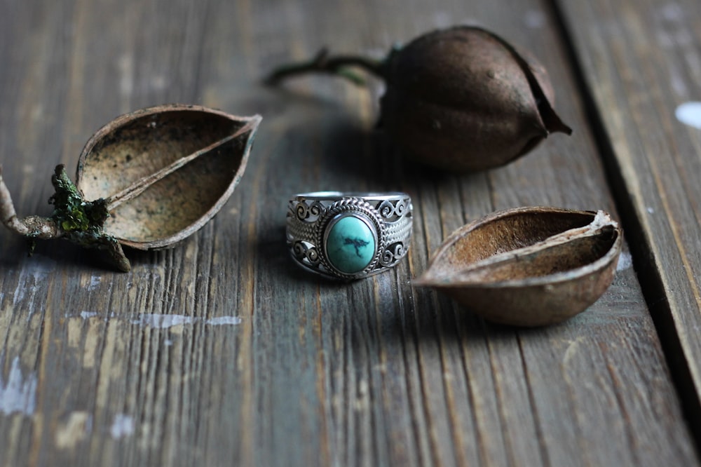 silver ring on brown surface