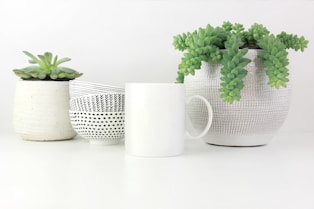 white ceramic cup on white surface