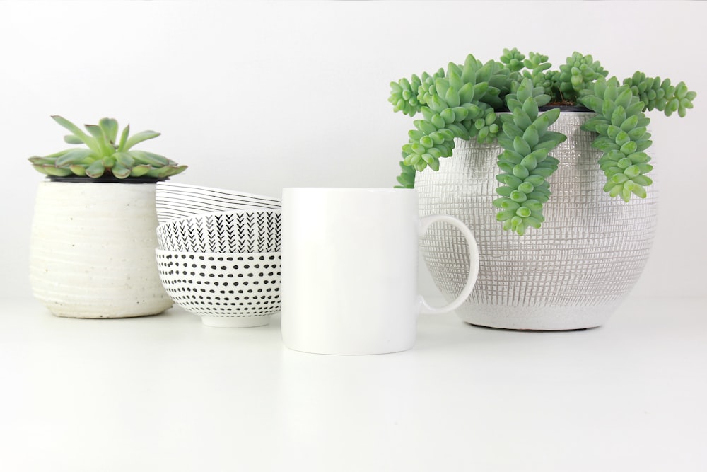 white ceramic cup on white surface