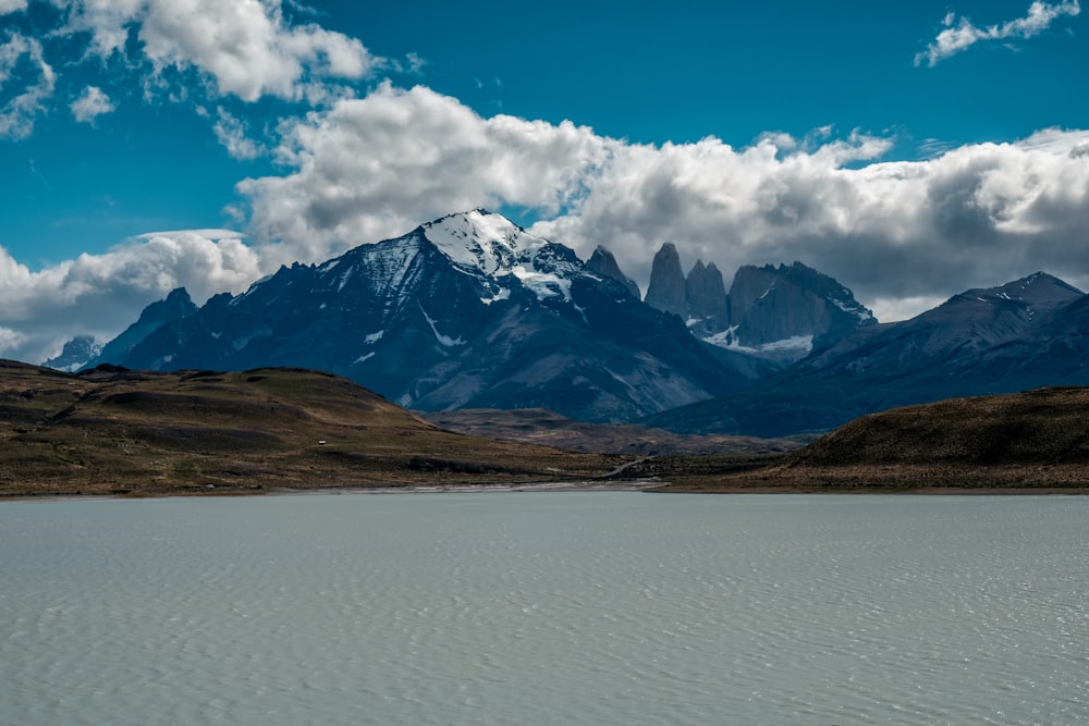 gray mountain across body of water