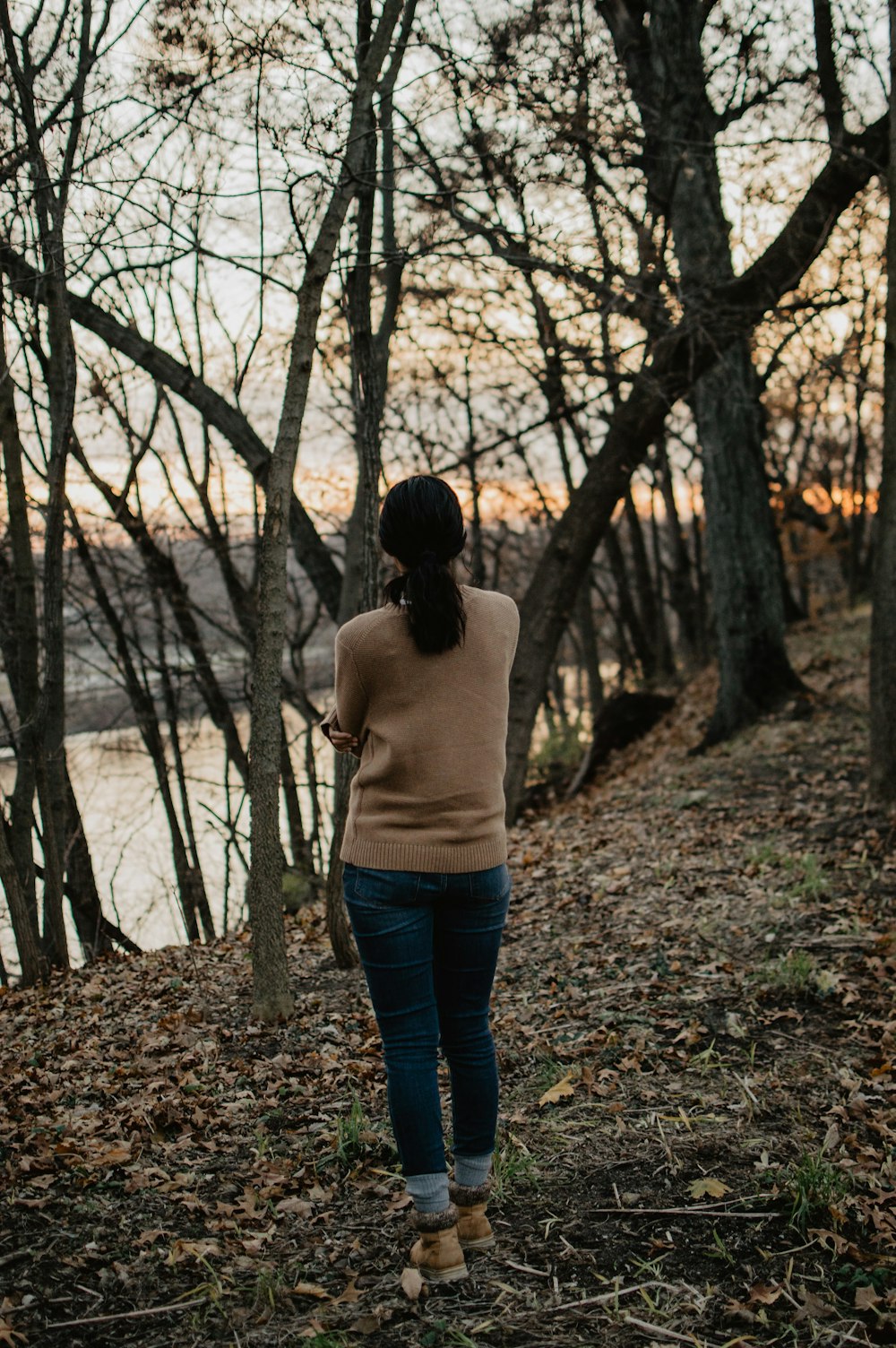 woman standing near trees