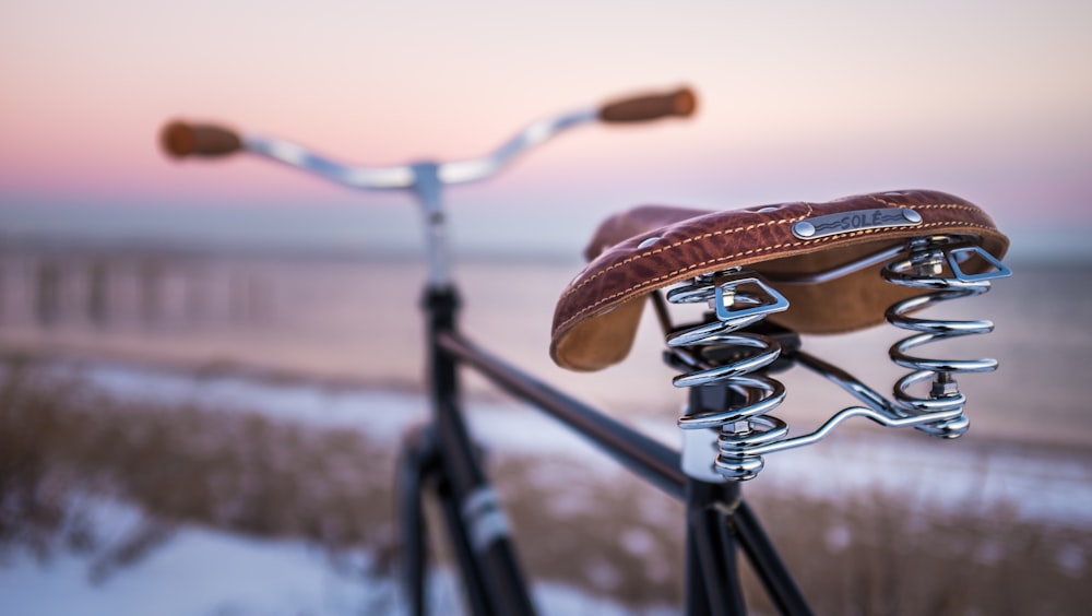 shallow focus photo of black regular bike