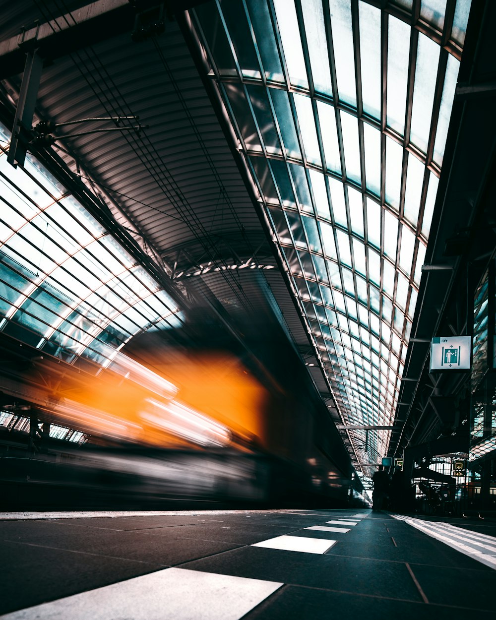 timelapse photography of train inside building