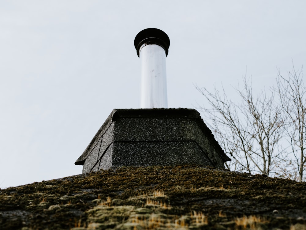 a chimney on top of a building with a sky background