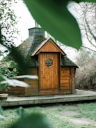 brown wooden house near trees