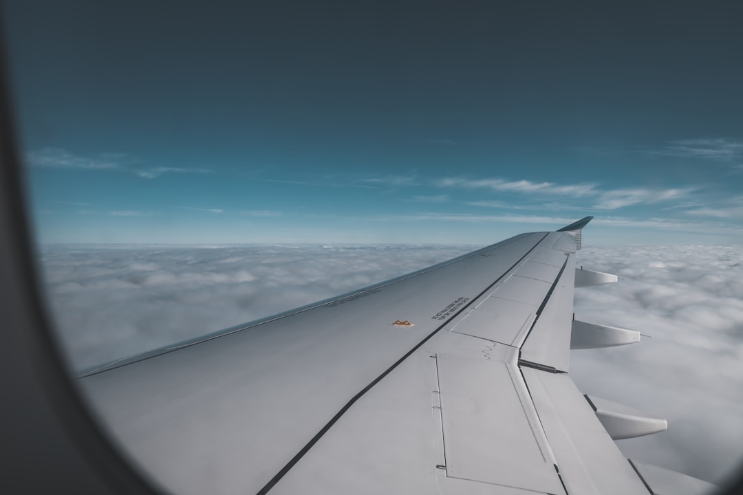 airplane wing window view, Over the clouds