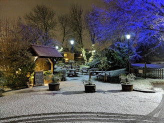 An outdoor event space adorned with snowflake decorations and illuminated winter props creating a magical atmosphere.