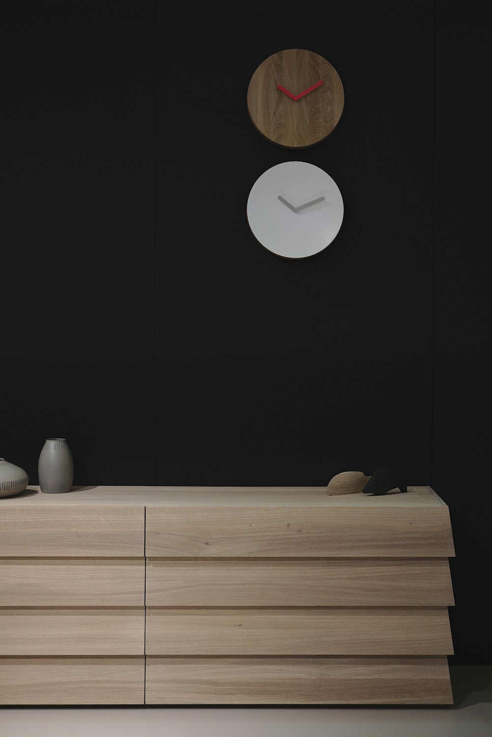 a wooden cabinet with a clock on the wall