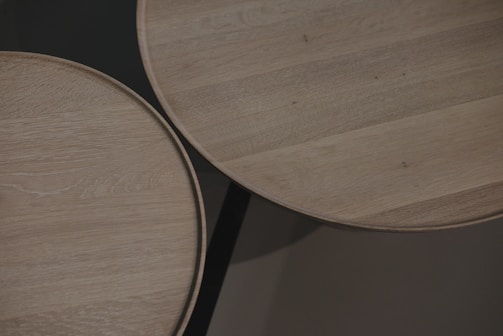 A sleek epoxy tabletop with embedded natural wood patterns.