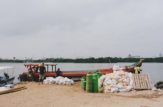 Loading dock with trucks being swiftly loaded with bulk rice bags for export.