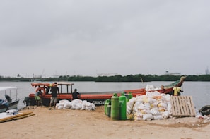 Loading of fertilizer bags onto a shipping container at a dock