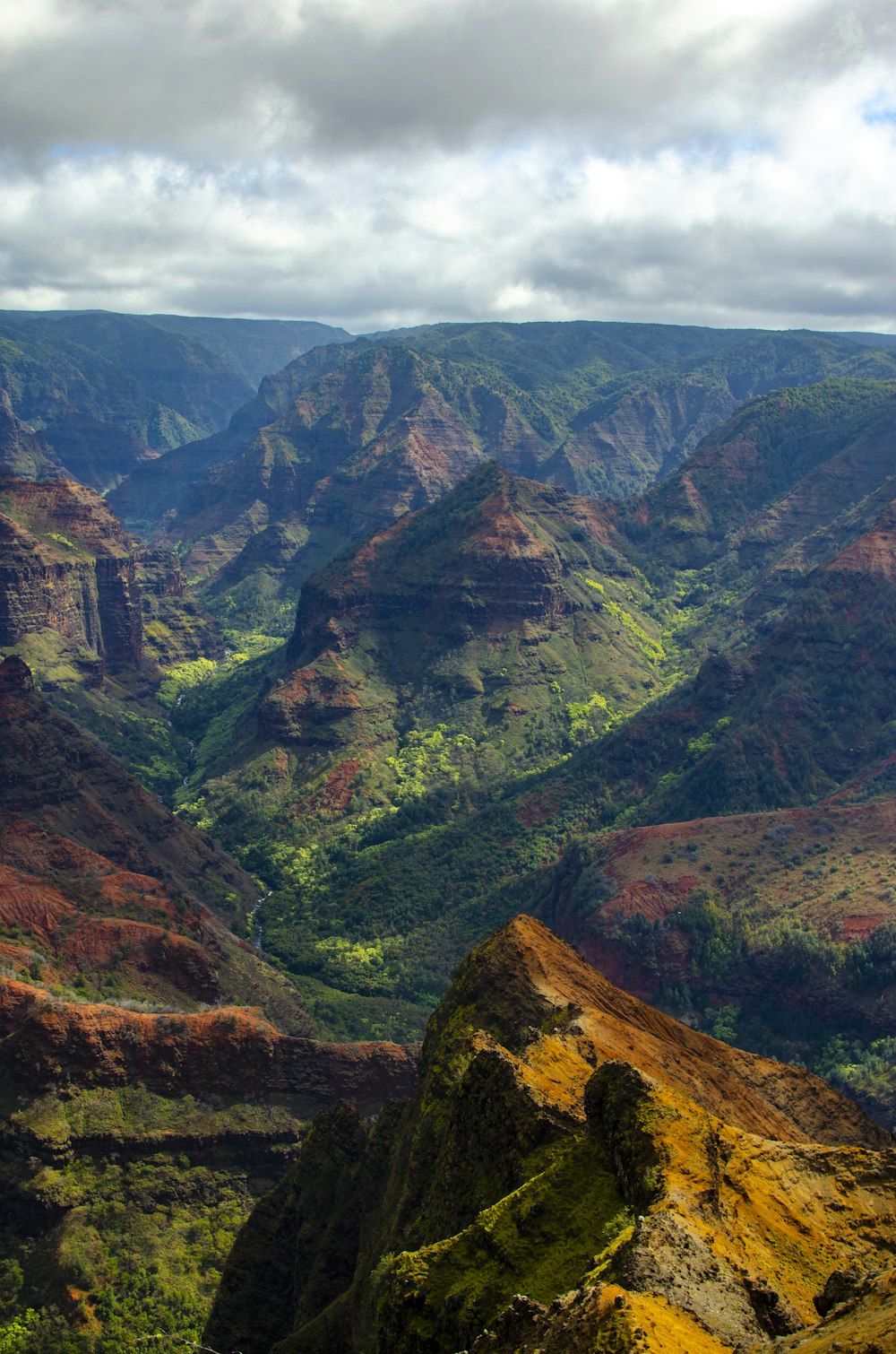 aerial photography of green and brown mountains at daytime