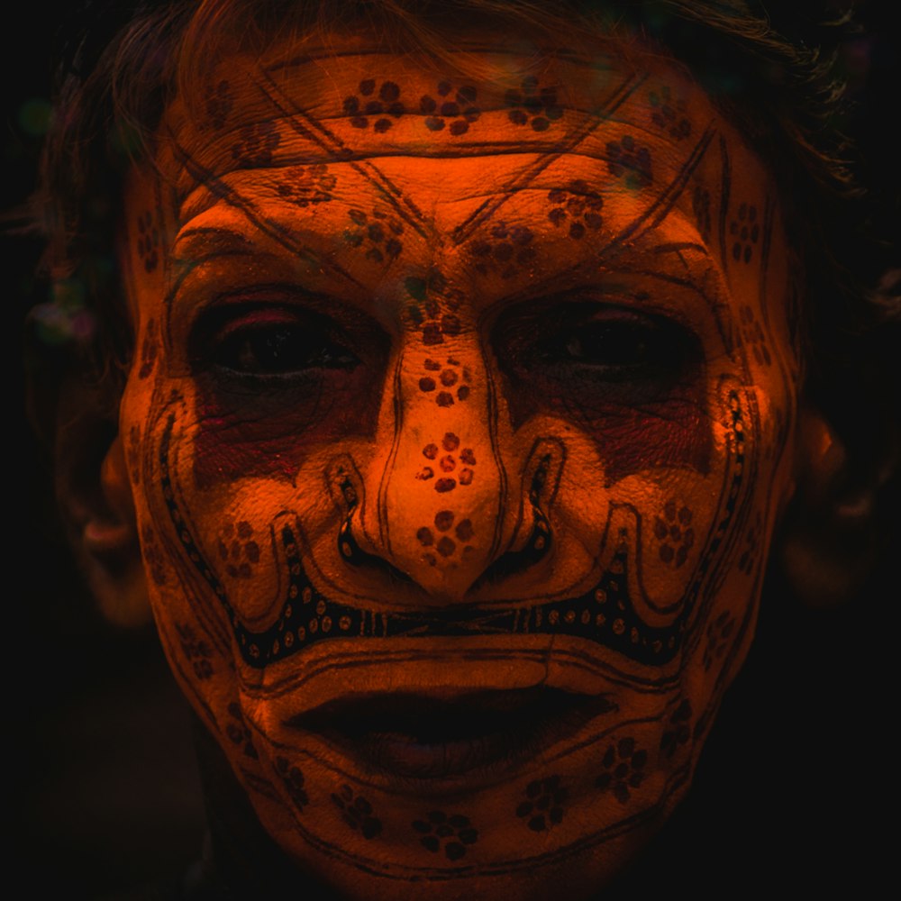 man's face with tattoo