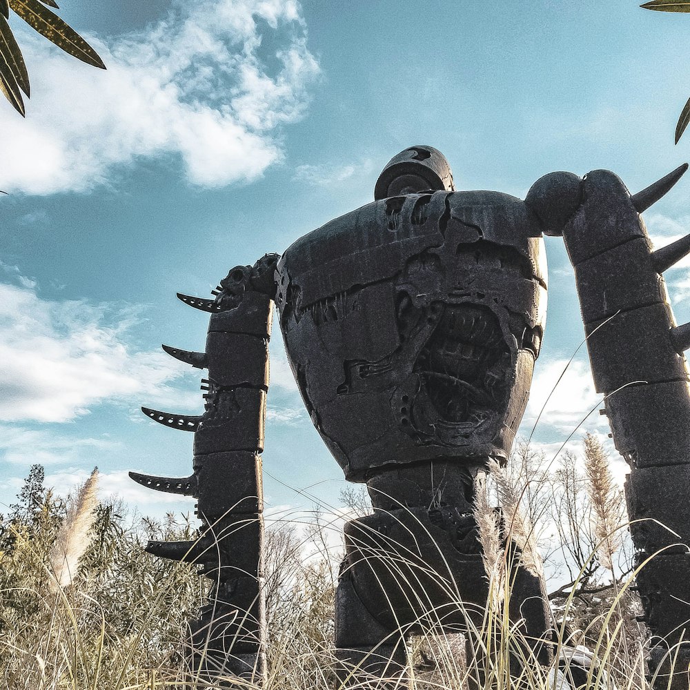 gray robot concrete statue