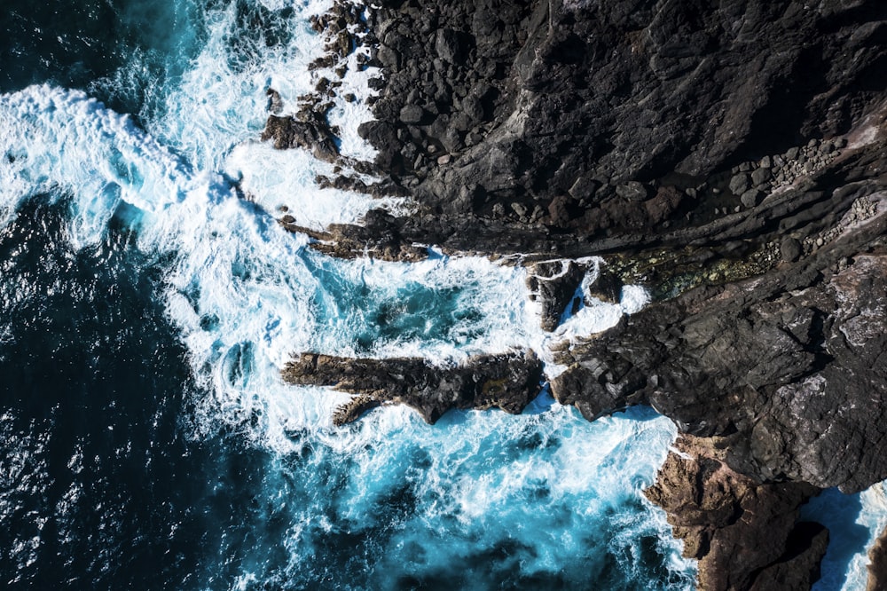 aerial view of rock at the beach