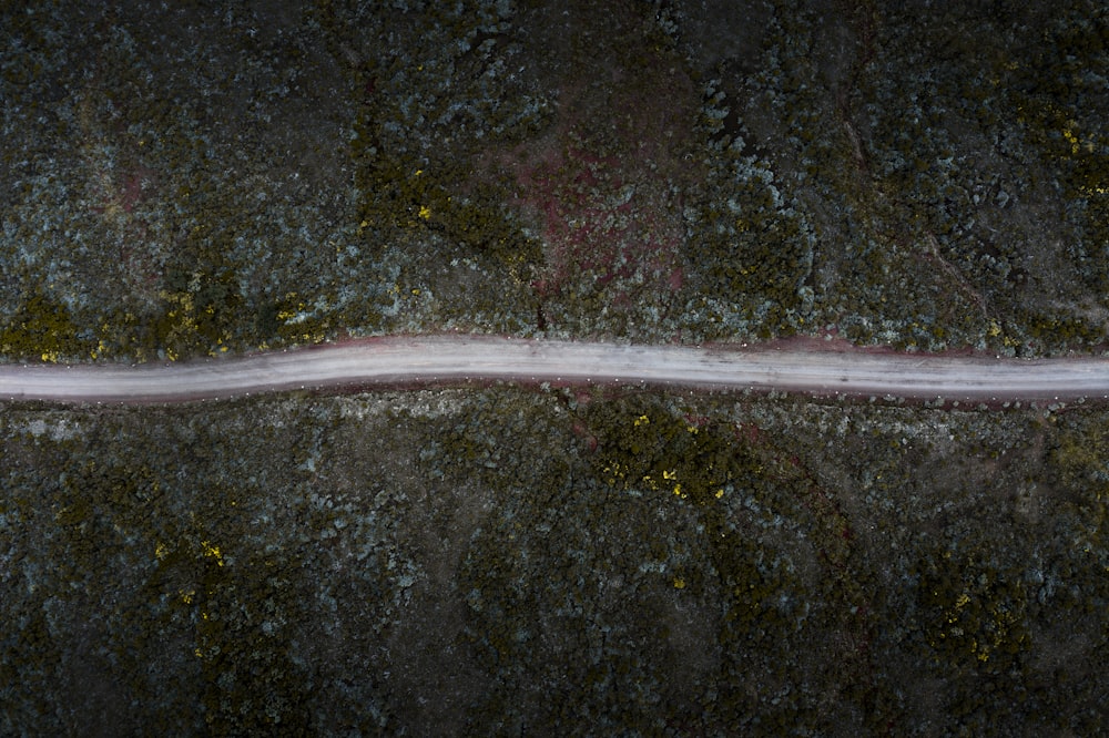 a long white line on the side of a road