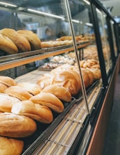 Rows of different bread types displayed neatly in the bakery showroom.