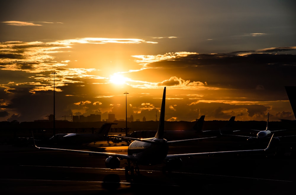 airplane on runway during golden hour