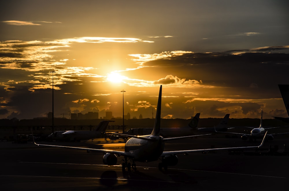 airplane on runway during golden hour