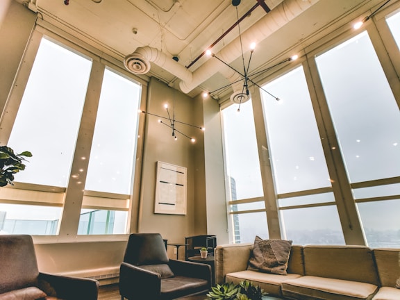 Common lounge area with comfortable seating and natural light streaming in.