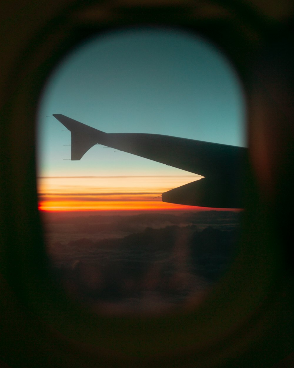 wing of airliner during golden hour