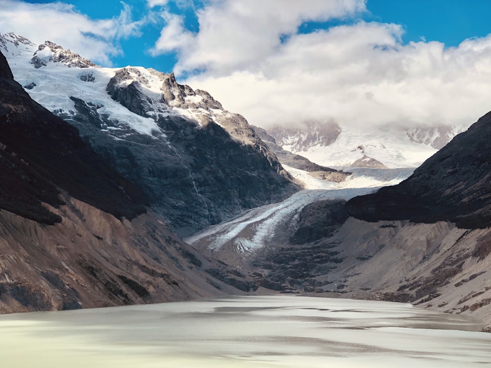 rock mountains covered by clouds