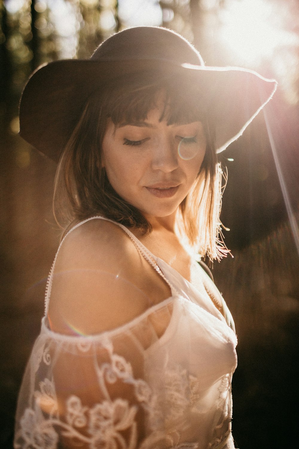 woman in black hat in selective focus photography