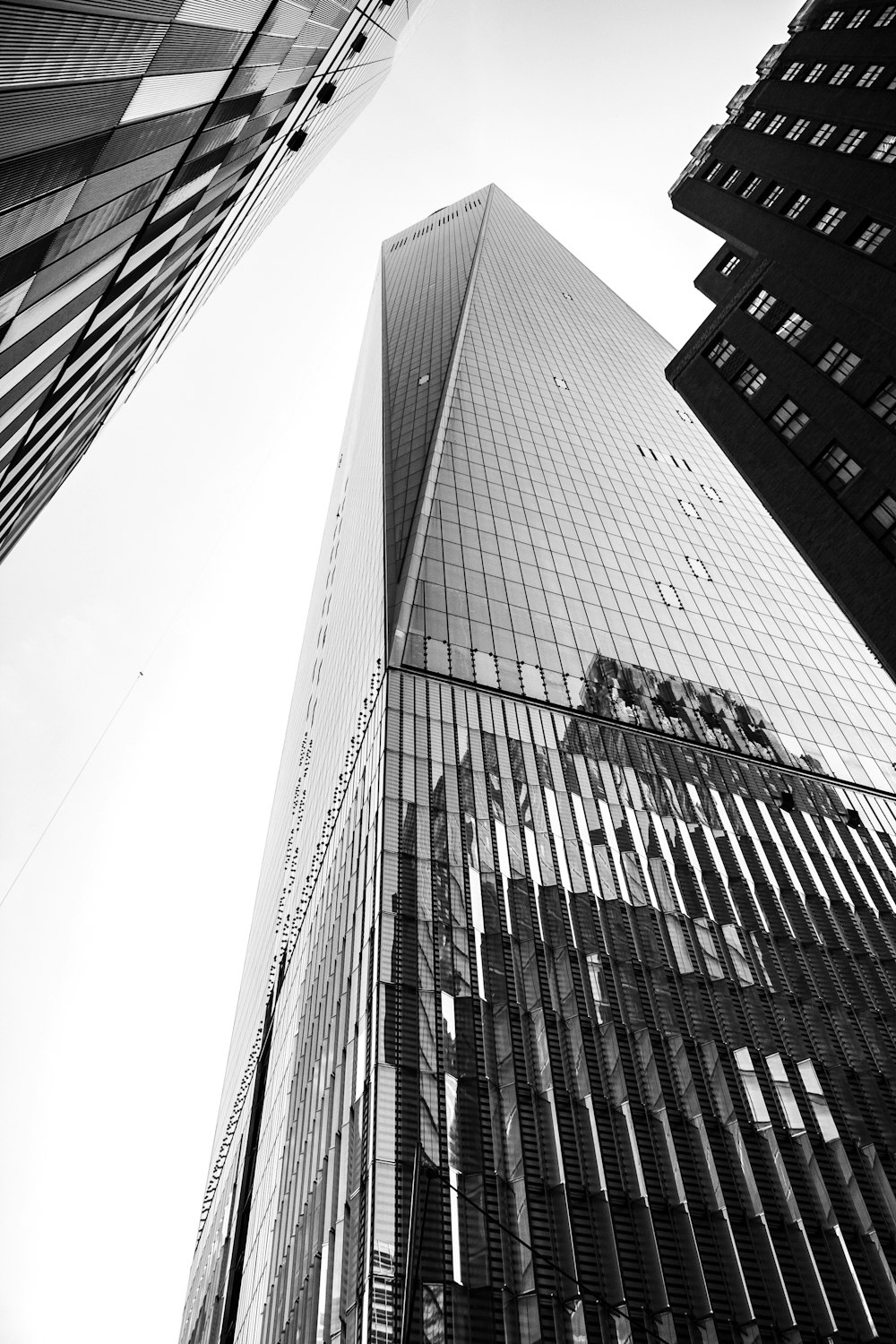 low-angle photography of curtain-wall high-rise building during daytime