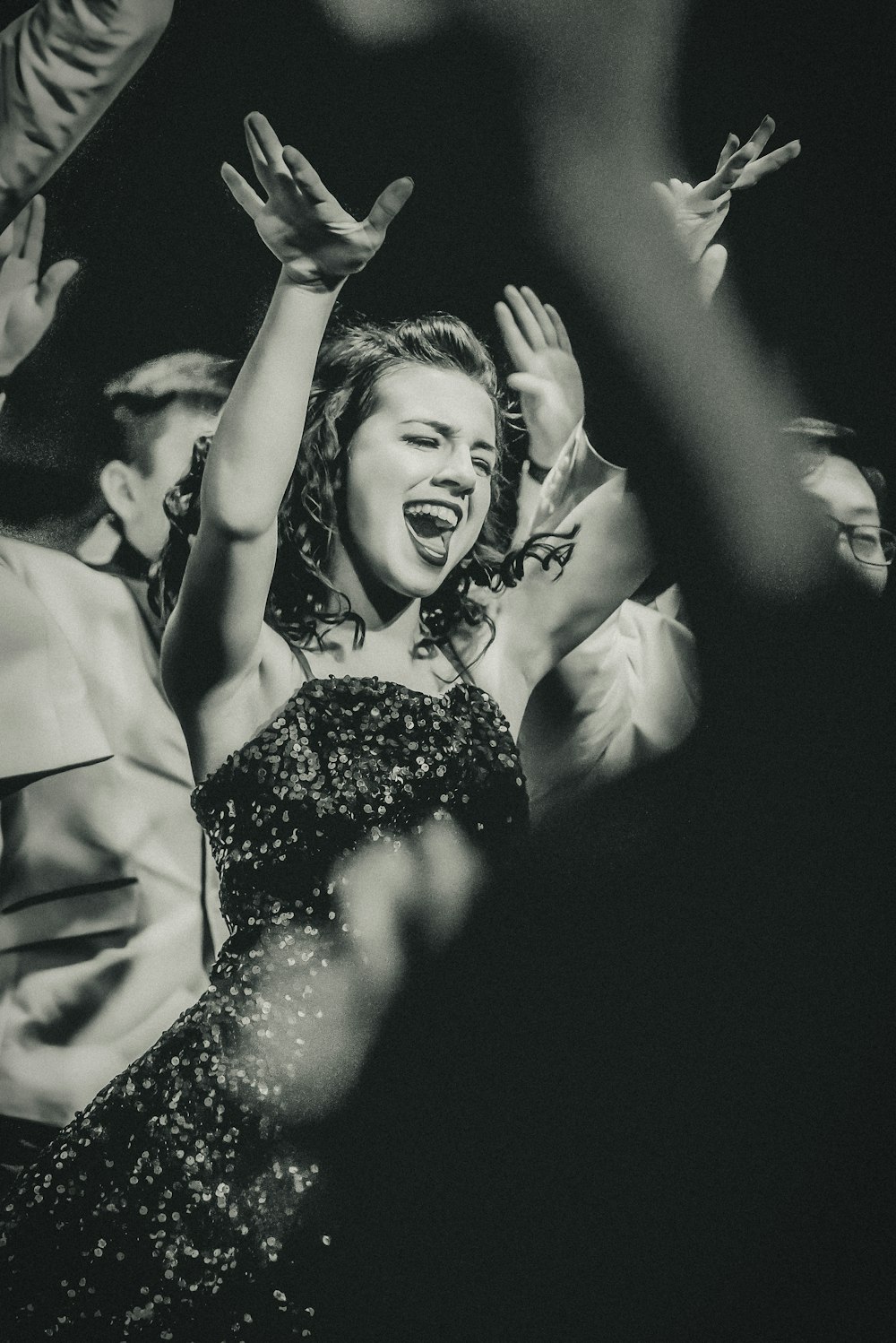 woman raising her hands