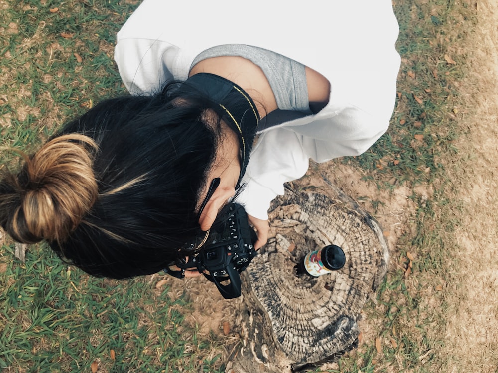 aerial view photography of woman holding camera