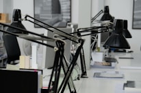 An office setting showcasing a bustling typing center with staff assisting customers.
