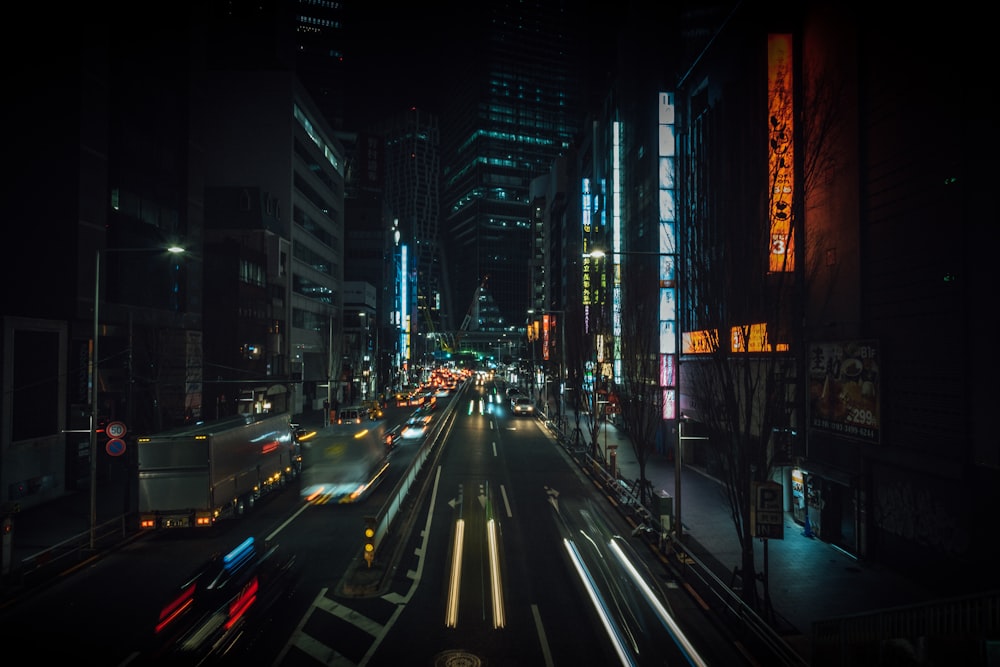 time lapse photography of cars between building