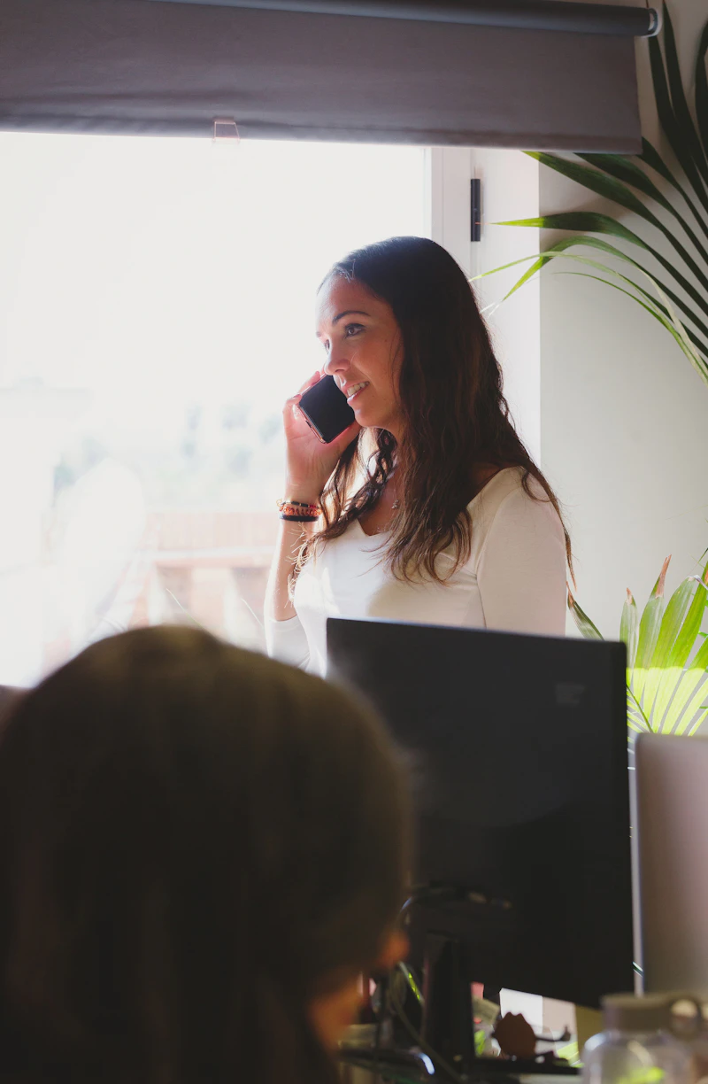 A Summit Ridge coordinator on the phone scheduling an inspection