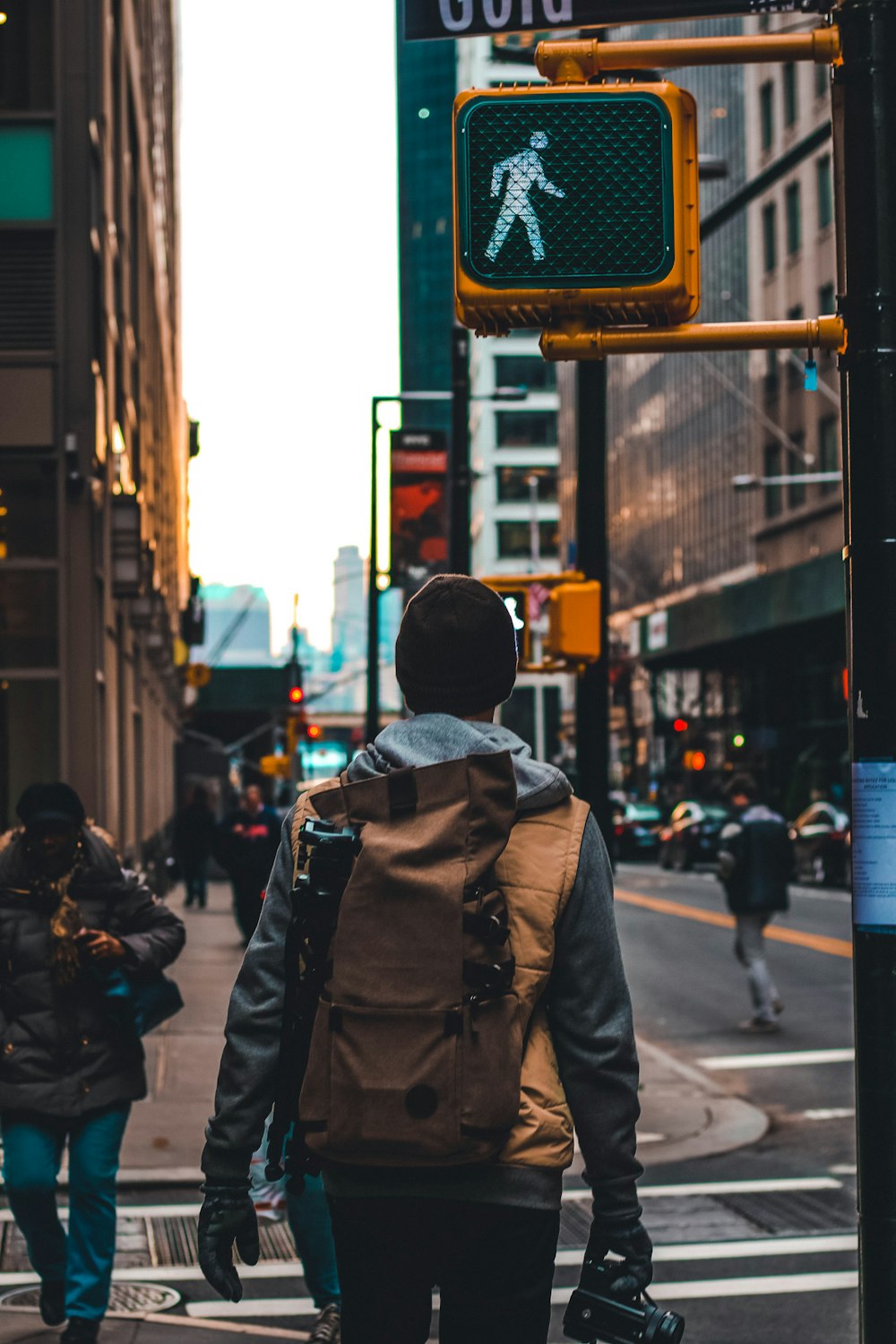 man walking beside road