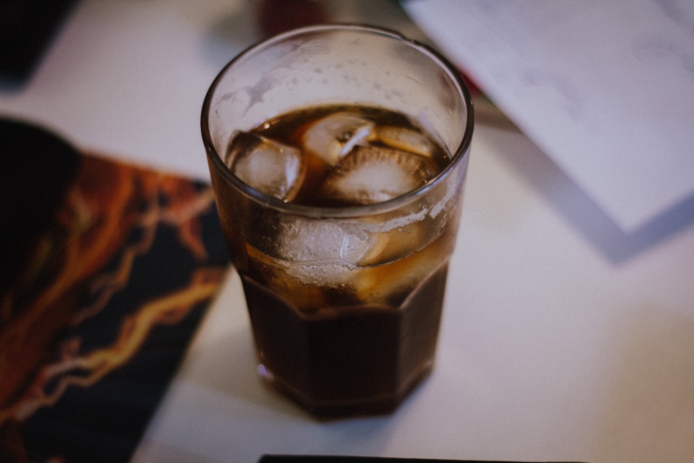 clear drinking glass with brown soda and ice cubes, cannabis sodas, Tacoma dispensary