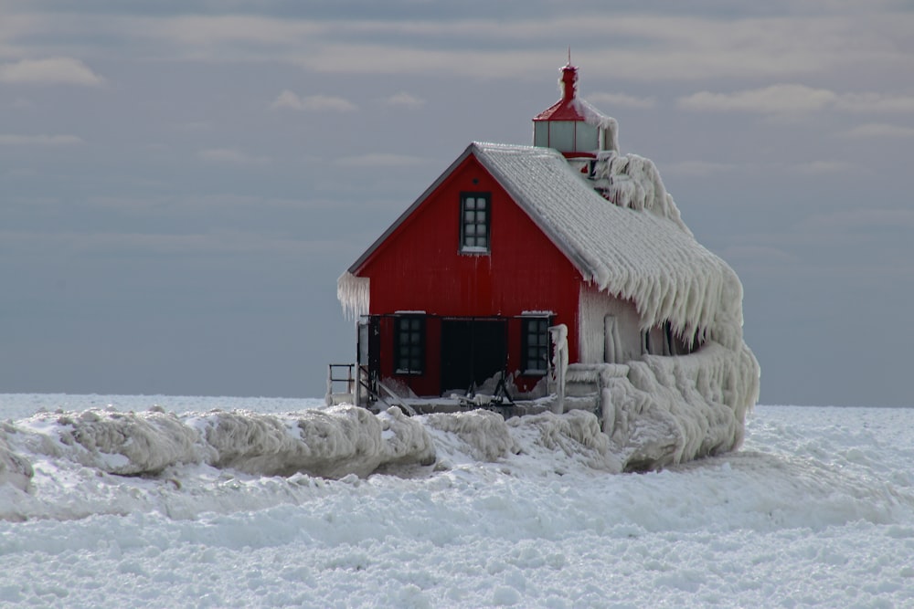 red and white house covered with snow