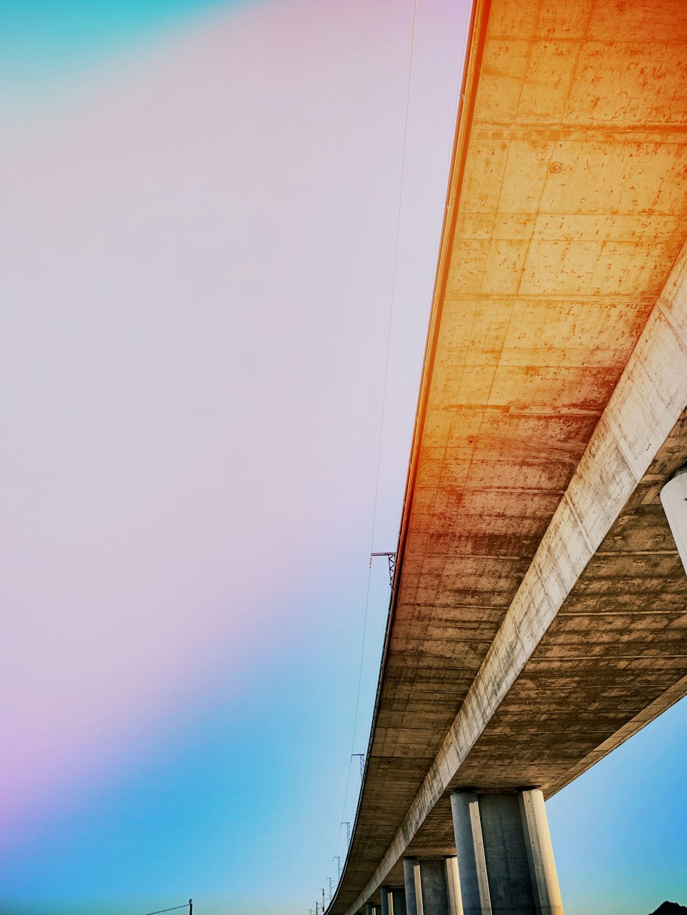 gray flyover bridge under why sky