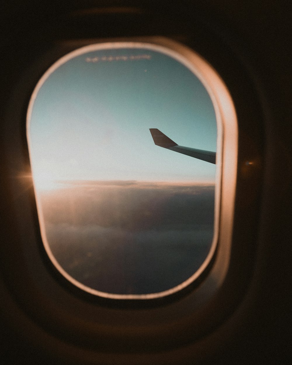 airplane window view of sunset