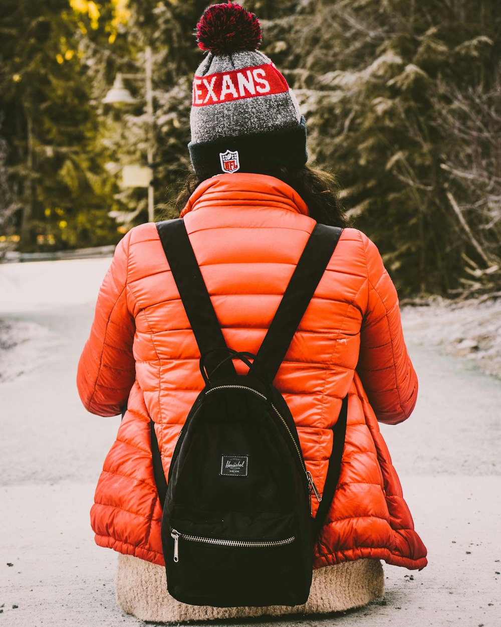 woman wearing gray and red knitted bennies