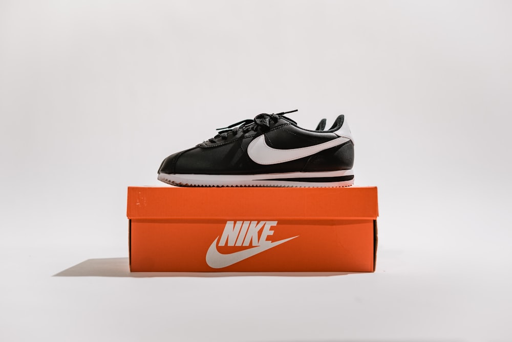 black-and-white Nike low-top sneakers with box