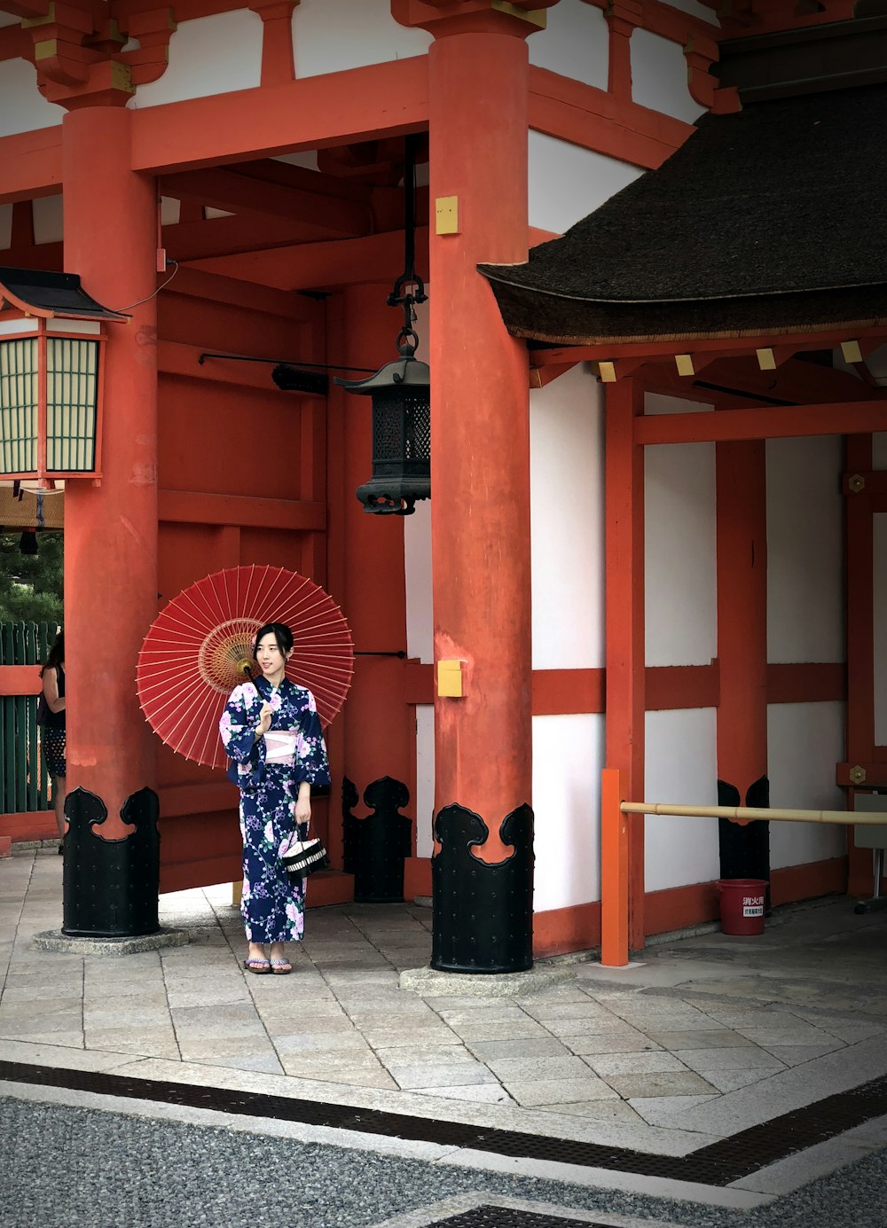 woman wearing yukata with red umbrella
