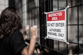 Restricted area sign on a caged security area: Klaxon conducts physical penetration tests