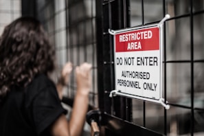 Restricted area sign on a caged security area: Klaxon conducts physical penetration tests