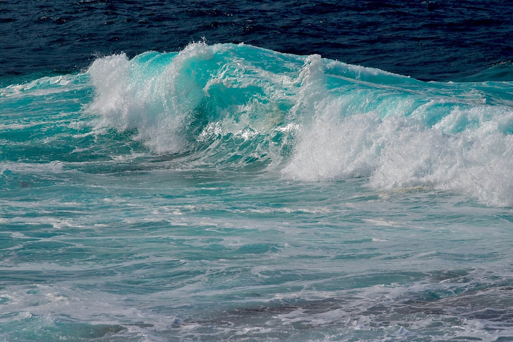 selective focus photography of ocean waves during daytime