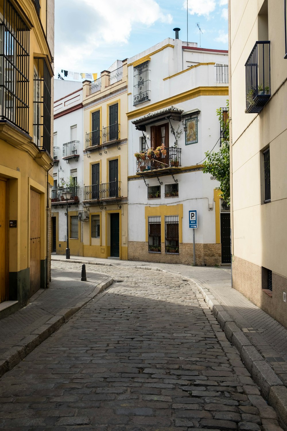 gray road between buildings