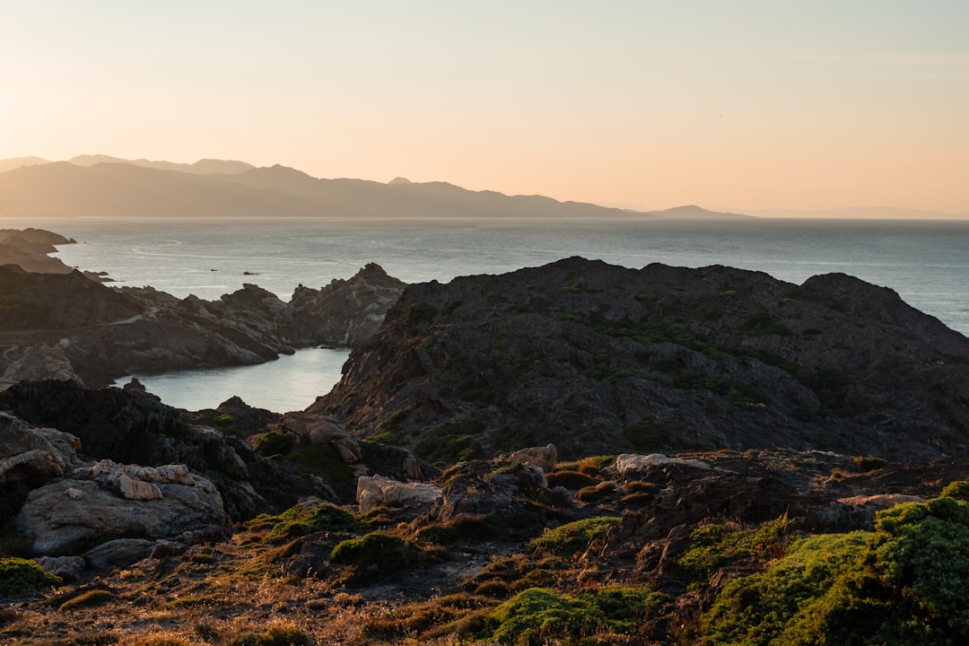 landscape photo of mountains near body of water during daytime